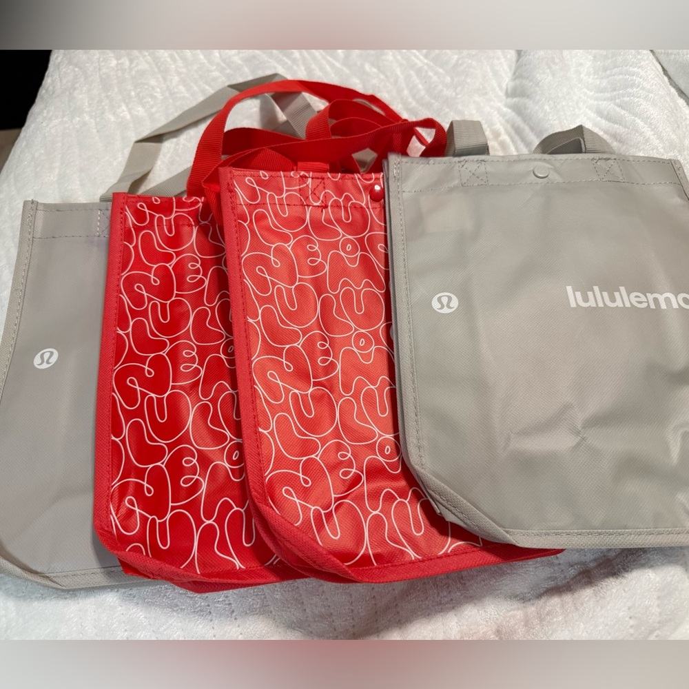 lululemon athletica shopping Tote Bags. Choose red or gray. Never used